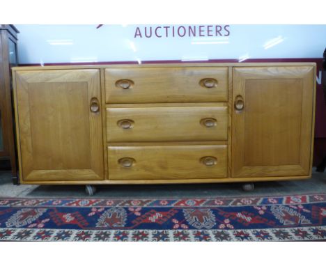 An Ercol Blonde elm Windsor sideboard 