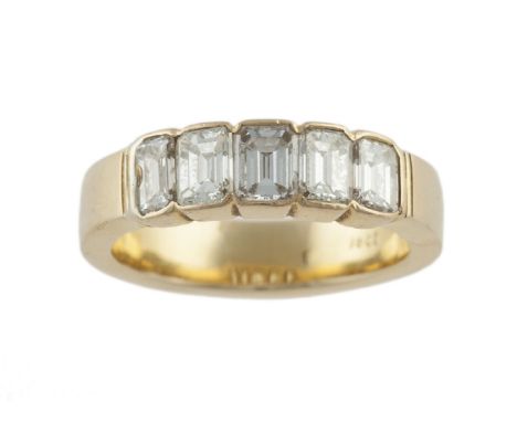 A diamond five-stone ring, set with a row of rectangular step-cut diamonds to front, mounted in 18 carat gold, diamonds appro