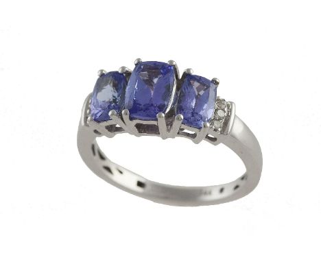 An amethyst three-stone ring, composed of graduated cushion mixed-cut amethysts to single-cut diamond shoulders, mounted in 1