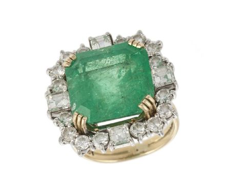 A diamond and emerald ring, the square step-cut emerald to a round brilliant-cut and square mixed-cut diamond surround, mount