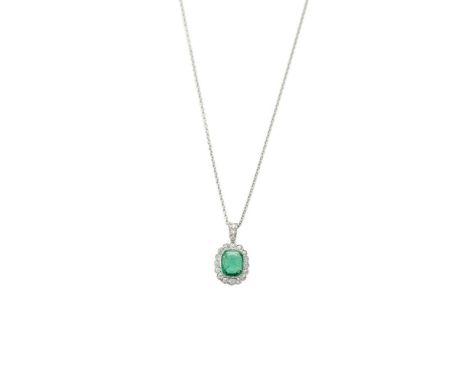 A diamond and emerald pendant, composed of a cushion-cut emerald to a surround of old round brilliant-cut diamonds suspended 