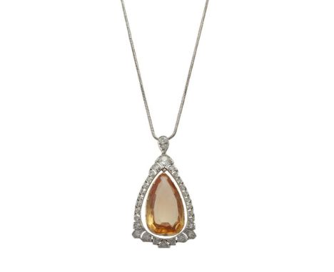 A diamond and topaz pendant, composed of an oval mixed-cut topaz within an old cushion-cut and old round brilliant-cut diamon