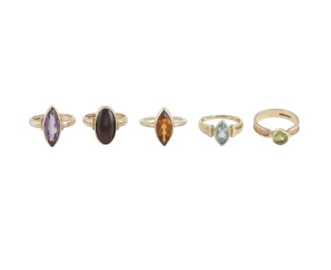 A collection of 9 carat gold and gem-set rings, comprising a navette-shaped amethyst ring, together with a citrine ring of si