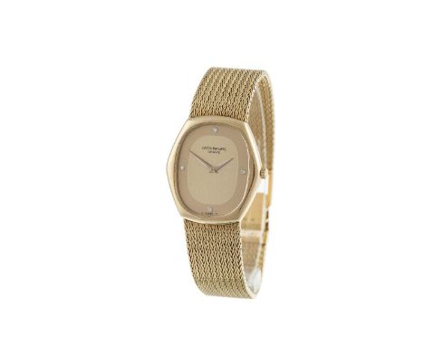 A Gentleman's 18 carat gold automatic wristwatch by Patek Philippe, oval dial with single-cut diamond indexes, feuille hands,
