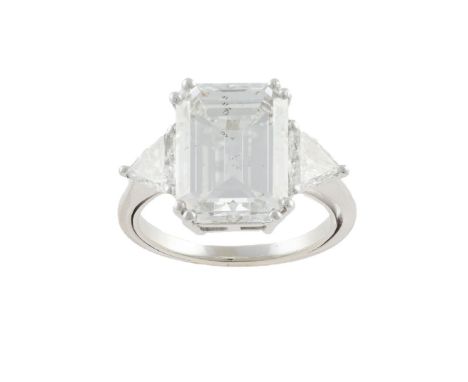 A diamond single-stone ring, the rectangular step-cut diamond between trilliant-cut diamonds, mounted in platinum, diamond 6.