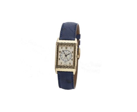 A Gentleman's 18 carat gold Reverso wristwatch by Jaeger LeCoultre, the rectangular cream dial with gold Arabic numerals, cal