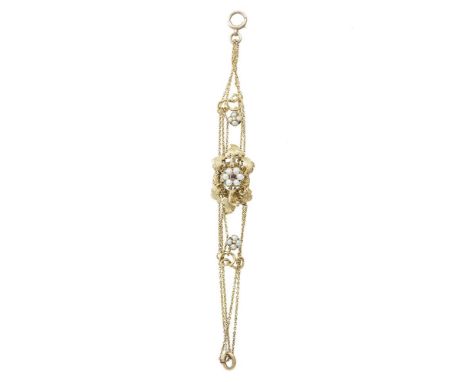 A mid 19th Century pearl and garnet bracelet, the central openwork lozenge of naturalistic form centrally set with a pearl an
