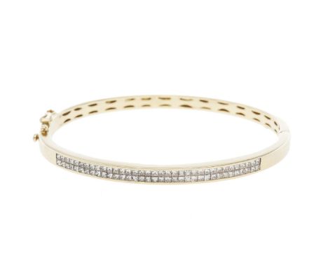 A diamond and 18 carat gold bangle, the hinged design set to front with a double row of princess-cut diamonds, 2.45 carat tot