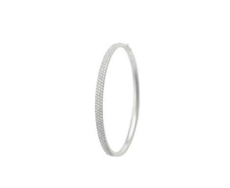 A diamond bangle by Tiffany & Co. composed of three rows of round brilliant-cut diamonds to front to a hinged 18 carat gold m