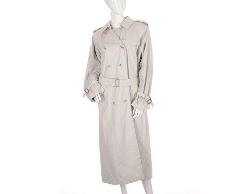 Burberry, a ladies trench coat, designed with a notched lapel collar, buttoned epaulettes, deep back yoke, double breasted bu