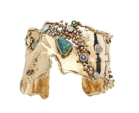 A modernist 9ct gold black opal, diamond and gem-set cuff bangle, with original sales invoice for the opal stating 2.50ct, li