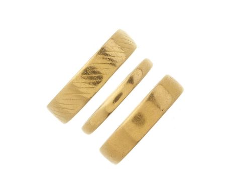 Three 22ct gold band rings, hallmarks for Birmingham and London, ring sizes J to O, 9.5gOverall good conditionSome light mark
