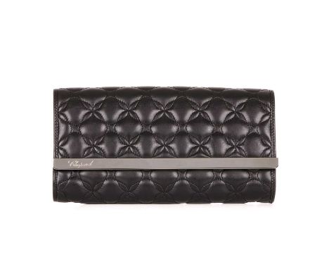 Chopard, an Imperial black quilted leather clutch, featuring a polished silver-tone front bar engraved with the maker's logo,