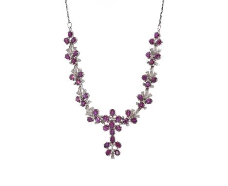 A set of mid 20th century 18ct gold ruby and diamond jewellery, to include a foliate drop necklace and a pair of matching ear