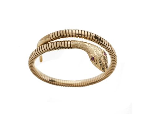 A 9ct gold flexible snake bangle bracelet, with ruby eyes and engraved head, hallmarks for Birmingham 1982, approximate inner