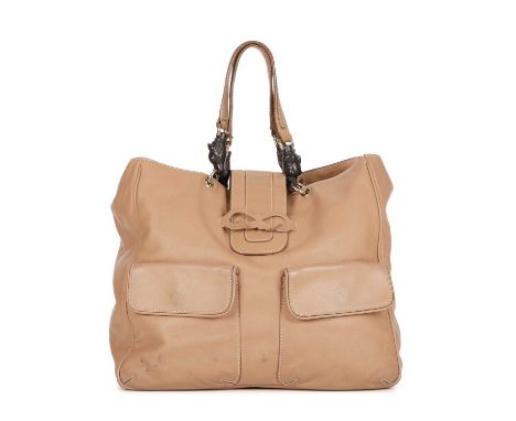 Anya Hindmarch, a beige leather handbag, featuring two front patch pockets, magnetic flap closure with leather bow detail, du