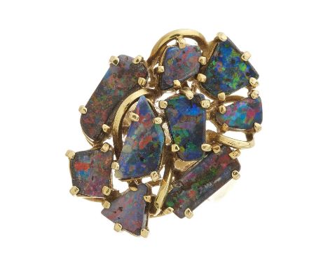 An 18ct gold boulder opal cluster dress ring, designed as a series of scattered opal cabochons, stamped 18k, ring size N, 7.7