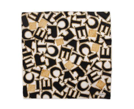 Cartier, a silk jacquard scarf, featuring black Cartier lettering on a white background with surrounding gold jewels, measuri