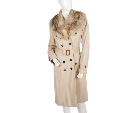 Burberry, a ladies trench coat with detachable fox fur collar, featuring double breasted front button fastenings, a belted wa