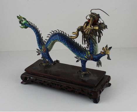 A Chinese white metal and cloisonne enamel "dancing dragon", 20th century, having cloisonne enamelled scaled body with filigr