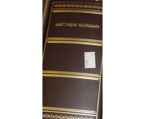 A Matthew Norman oval brass carriage clock, c.1980, having white enamel dial with Roman numeral chapter ring with outer minut