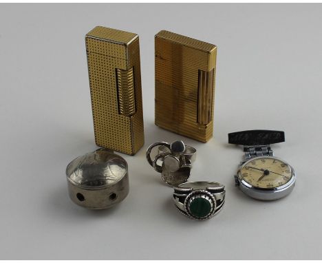 A Dunhill&nbsp;Rollagas gold plated lighter, c.1970, base impressed "US.RE24163 Patented", together with an S T Dupont gold p