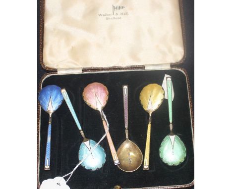 A cased set of six silver gilt and guilloche enamel spoons, by Walker &amp; Hall, assayed Chester 1939, having pear shape sil