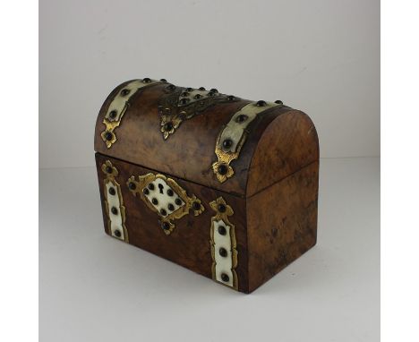 A Victorian dome top burr walnut tea caddy, decorated with engraved gilt metal and bone straps and escutcheon, with twin comp