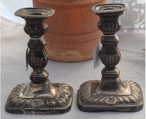 A pair of silver candlesticks, by Thomas Arthur Reid, Francis James Langford &amp; Christian Leopold Reid, assayed London 190