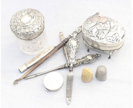 A silver trinket box, by William Comyns &amp; Sons, assayed London 1907, the hinged lid repousse scene of a lover on bended k