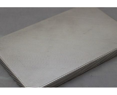 A fine silver rectangular cigarette case, by Jacques Cartier, assayed London 1949, having all rouind angular engine turned de