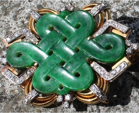 A Chinese "Endless knot" yellow metal, jade and diamond pendant/brooch, having pierced and carved central green jade "Endless