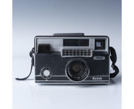 700 film camera, produced in the United States during the 1960s. Features a Kodak Ektanar 38mm f/2.8 lens, offering fixed foc
