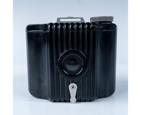 A vintage Kodak Baby Brownie Special camera, featuring a black Bakelite body with ribbed details and a clear flip-up viewfind