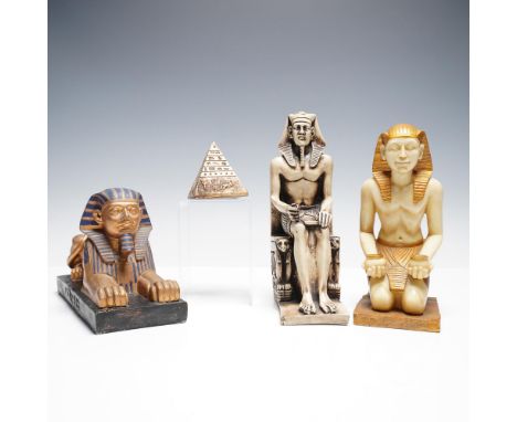A four piece collection of decorative figures inspired by Ancient Egyptian art and symbolism. This set includes a reclining S