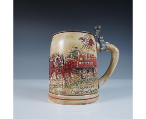 This Ceramarte Budweiser Champion Clydesdales lidded stein, made in Brazil, features a detailed relief design of the famous B