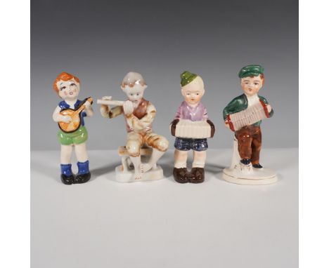 A charming collection of four vintage Occupied Japan porcelain figurines depicting musicians playing various instruments. Thi