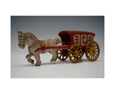 A vintage cast iron horse-drawn ice wagon toy featuring a single galloping horse attached to a red open wagon with embossed "
