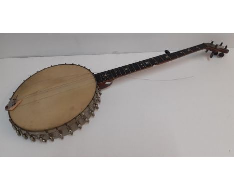 An early 20th Century metal open back and claw hammer, rosewood banjo, 5 strings (3 intact) and 5 pegs intactLocation: BWR 
