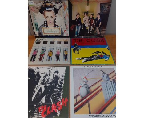 A quantity of LP's and 12" vinyl records to include The Clash, Culture Club, Sex Pistols, Black Sabbath, Pink Floyd, Thin Liz