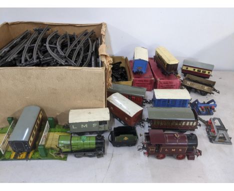 A collection of Hornby Meccano 0 gauge trains and accessories to include a 2115 LMS engine, boxed 'Chocolate Van Cadbury's' c