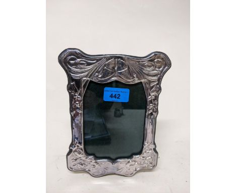 A modern embossed silver frame in the Art Nouveau style on an easel back, Birmingham 2000, silversmith's marks RH Location: 