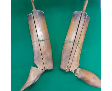 A pair of vintage treen boot stays stamped with the initials HP and R for Right leg and L for left leg, 27cm front to back of