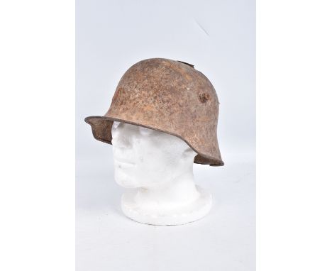 A WWI ERA GERMAN BATTLE DAMAGED HELMET, this has damage to the top in two places and has some light surface rust, this is jus