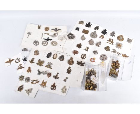 A COLLECTION OF VARIOUS MILITARY BADGES AND SHOULDER TITLES, they span various eras of the twentieth century, the shoulder ti