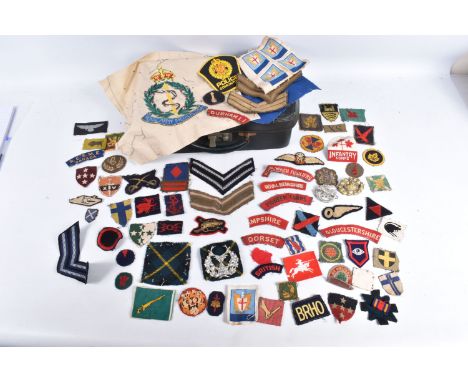 A COLLECTION OF WWII UNIFORM INSIGNIA GIVEN TO V.A.D NURSE JESS WINIFRED CAREY DURING WWII, Miss Carey treated hundreds of mi