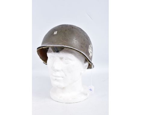 A USA ARMY STEEL HELMET, this is khaki green in colour and traces of black are coming through the paint, each side has a spad