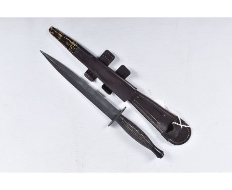 A THIRD PATTERN FAIRBAIRN SYKES COMMANDO FIGHTING KNIFE, this comes with its scabbard, the blade is approximately 18cm, the c