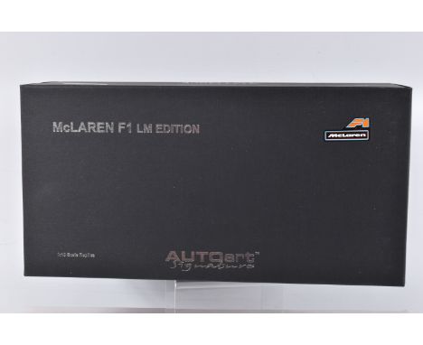 A BOXED AUTOART SIGNATURE MCLAREN F1 LM EDITION 1:18 SCALE MODEL VEHICLE, orange body, appears in new condition and housed in