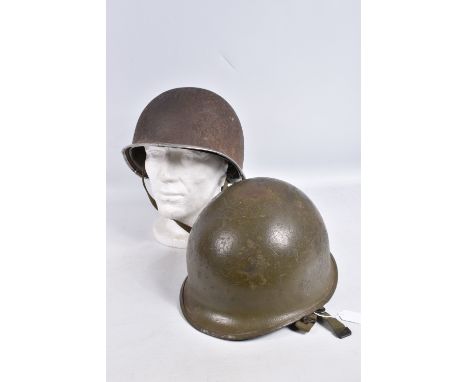 TWO USA ARMY STEEL HELMETS FROM WWII AND VIETNAM WAR ERA, the WWII era helmet is complete with inner liner and chin strap, th